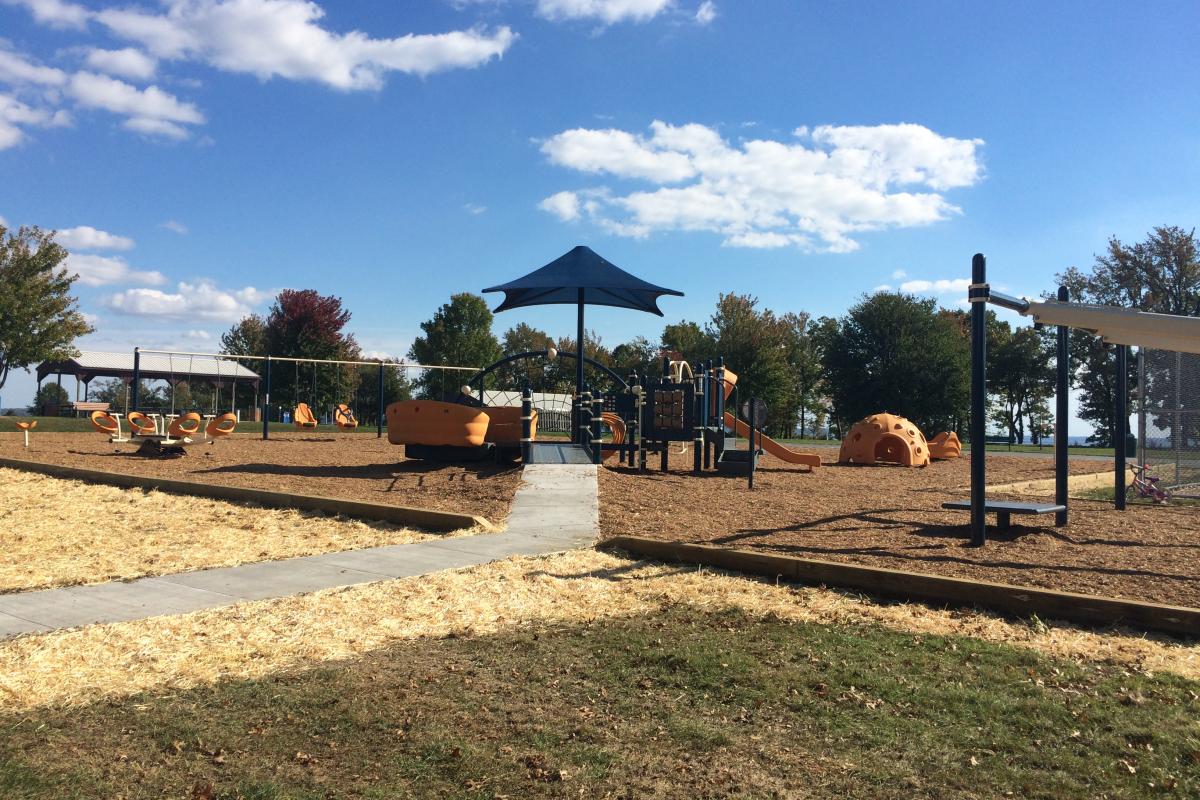 Looking up sidewalk, entering area of new Playground Equipment 2015